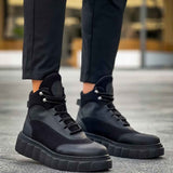 Black lace-up ankle boots with gray side panels and chunky outsole blocks