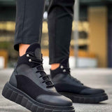 Black lace-up boots with gray paneling and thick block sole