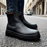 Men's black Chelsea boots with elastic side panels and chunky sole