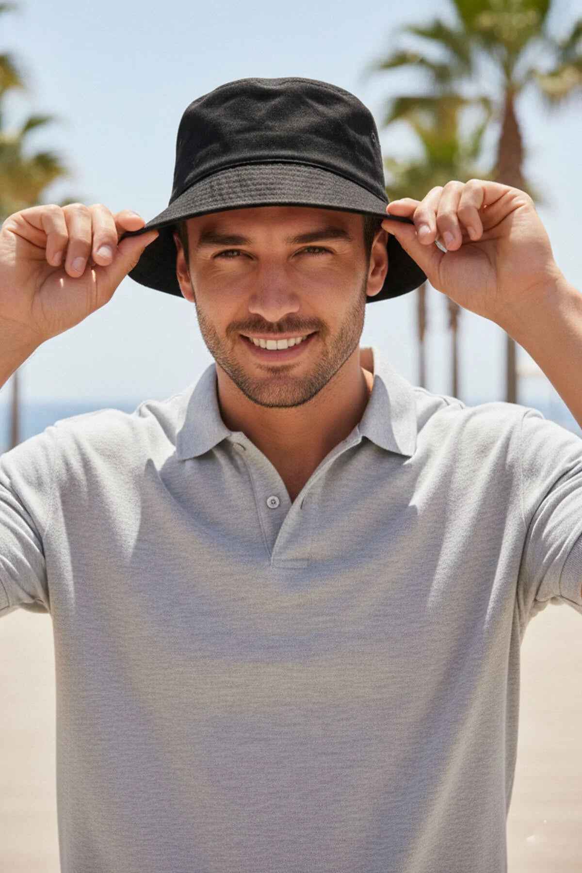Men's black bucket hat with wide brim, adjusted on head.