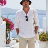 Men's black bucket hat with wide brim, worn.