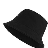 Black bucket hat with wide brim, side view.