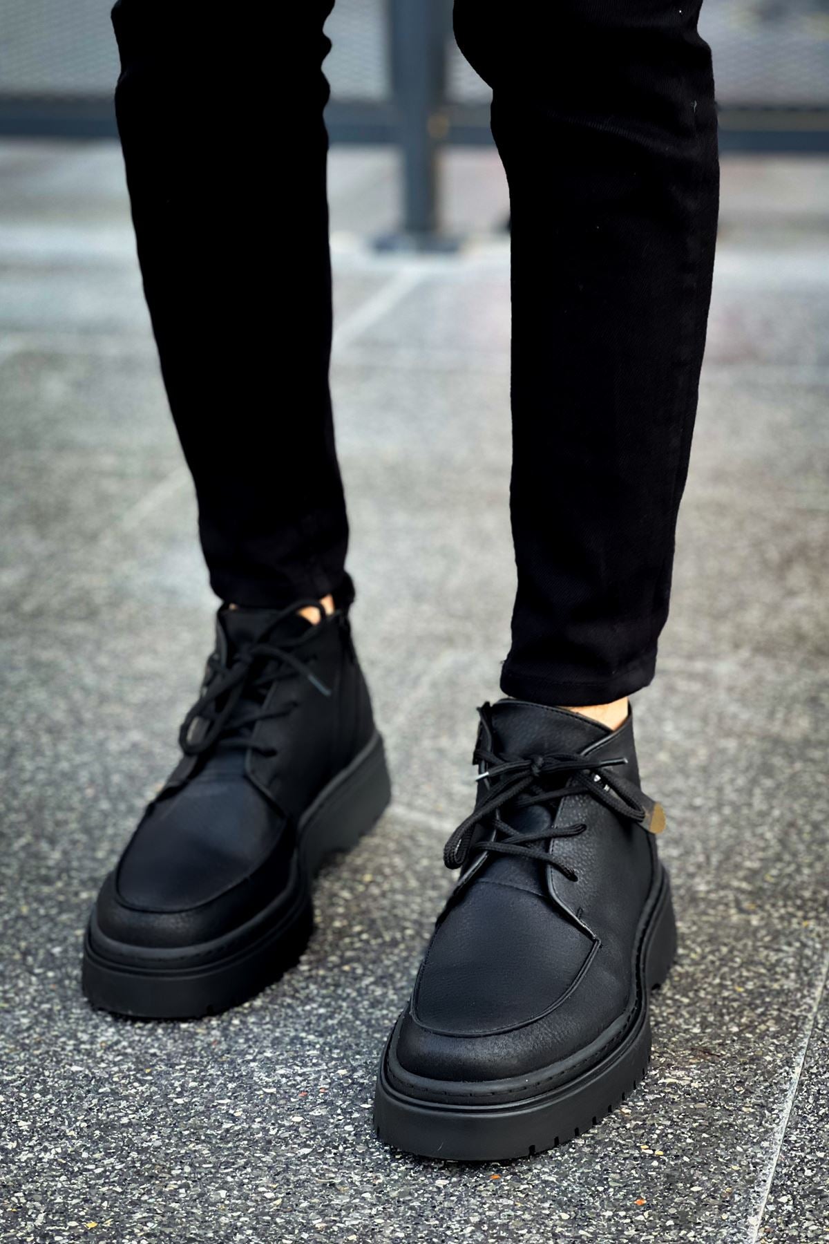 Men's black ankle lace-up boots with low-profile heel and grippy outsole