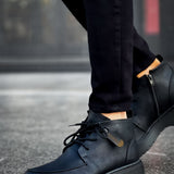 Men's black leather-look lace-up boots with stitched uppers and chunky sole