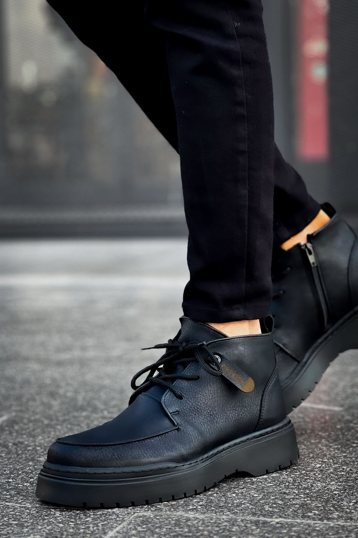 Men's black leather-look lace-up boots with stitched uppers and chunky sole