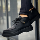 Men's black lace-up casual boots with textured upper and thick tread sole