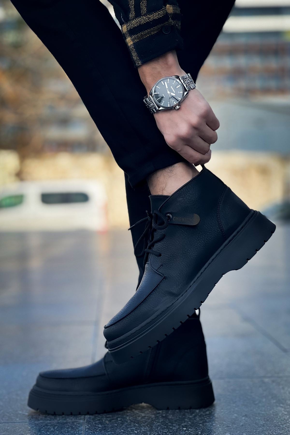 Men's black lace-up casual boots with padded collar and rugged outsole