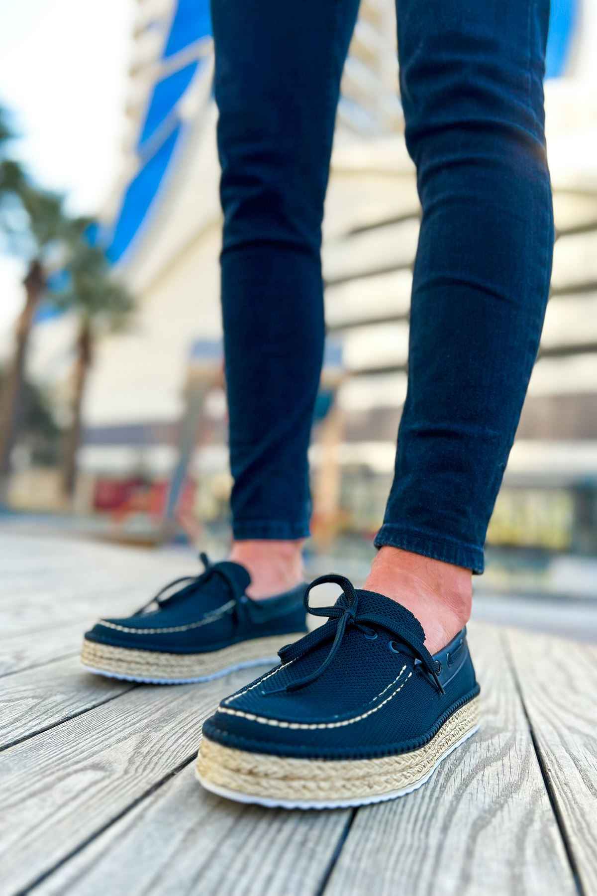 Men's espadrille shoes with dark canvas uppers, lace-up front, and jute rope sole