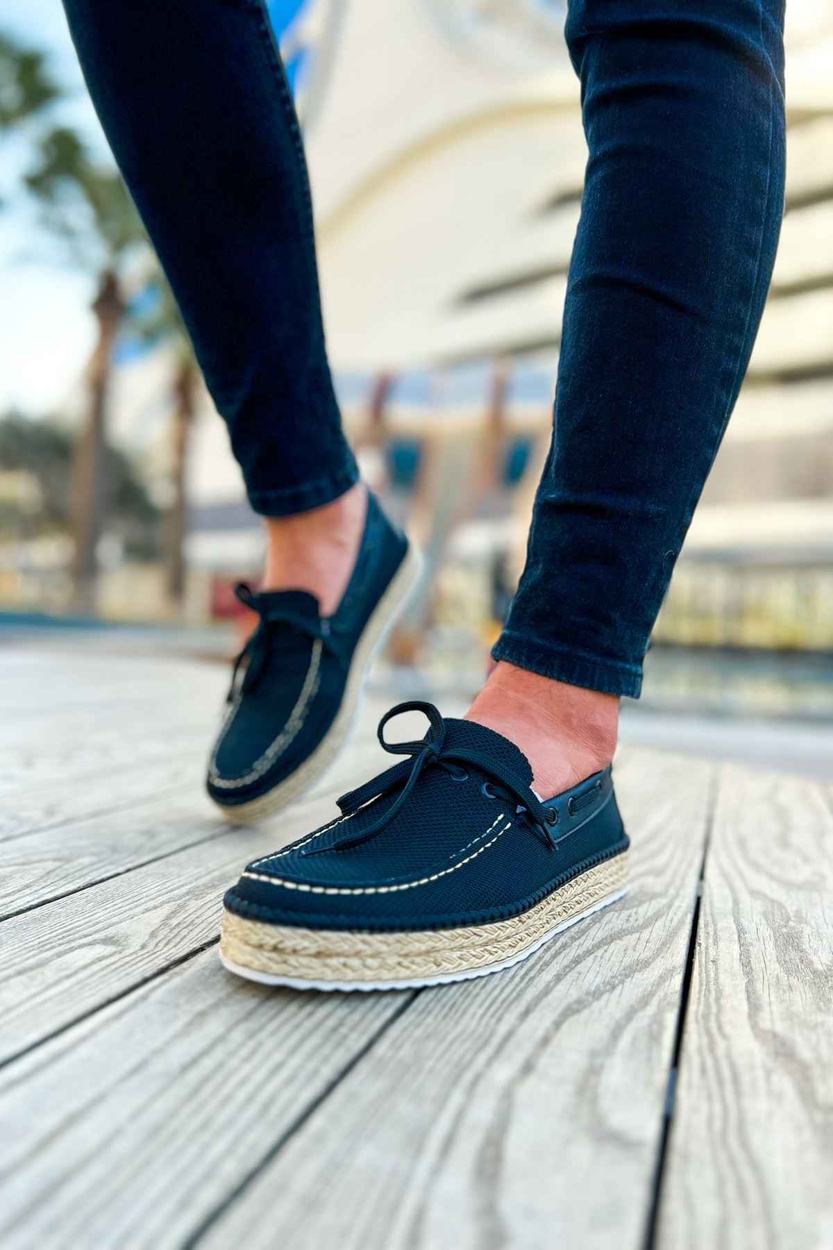 Men's espadrille shoes with dark canvas uppers, lace-up closure, and jute rope sole