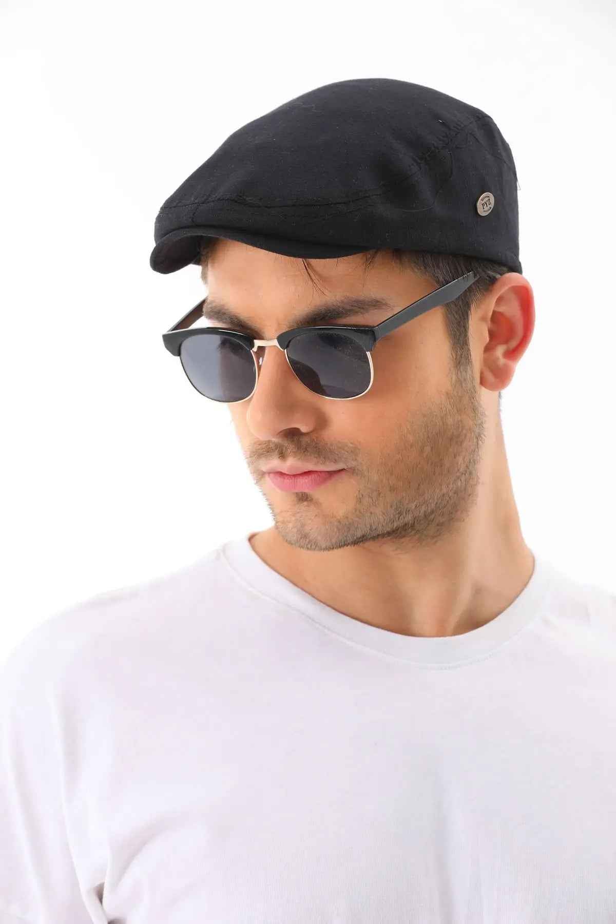 Men's black flat cap with small side logo button