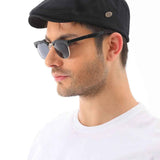 Men's black flat cap with side logo patch on brim