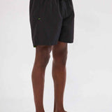 Men's black swim shorts with neon green drawstring and side seams