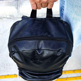 Black leather backpack with round top and front zip pocket