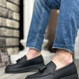 Men's black leather-look loafers with strap across vamp, slip-on design