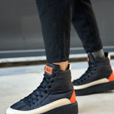 Men's lace-up boots in dark navy with orange accents and white toe, chunky tread sole