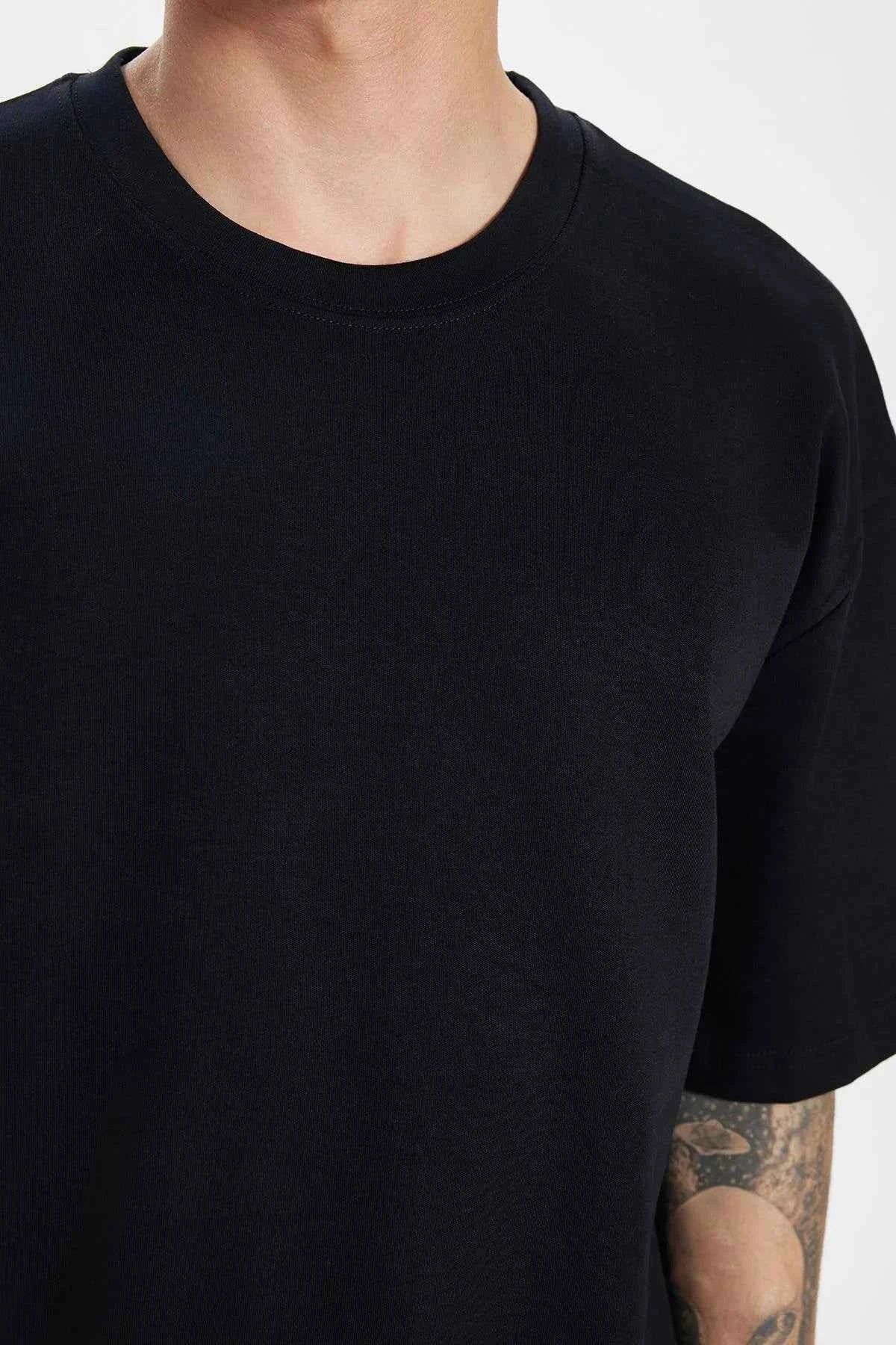Black crew-neck T-shirt neckline detail with short sleeves