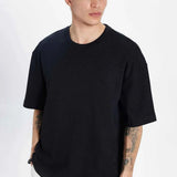 Men's oversize black crew-neck T-shirt, front view with draped short sleeves