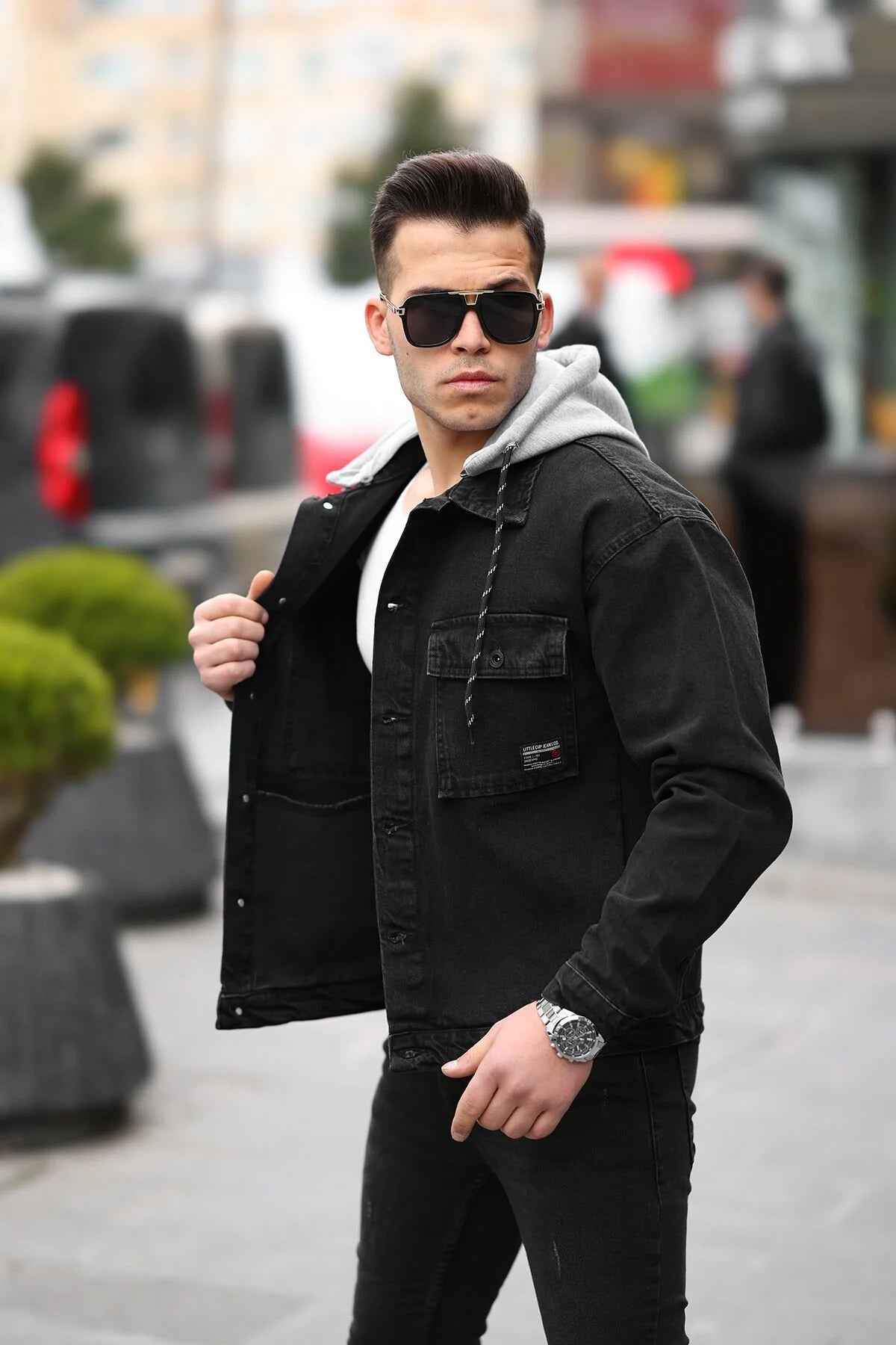 Men's black denim jacket with large chest pocket, sherpa collar, button front