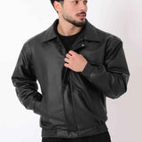 Oversized black leather jacket with stand collar, ribbed hem, and snap cuffs