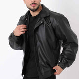 Oversized black leather jacket with snap buttons and front flap pockets