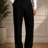 Men's black dress pants with belt loops, pleated front, and straight leg
