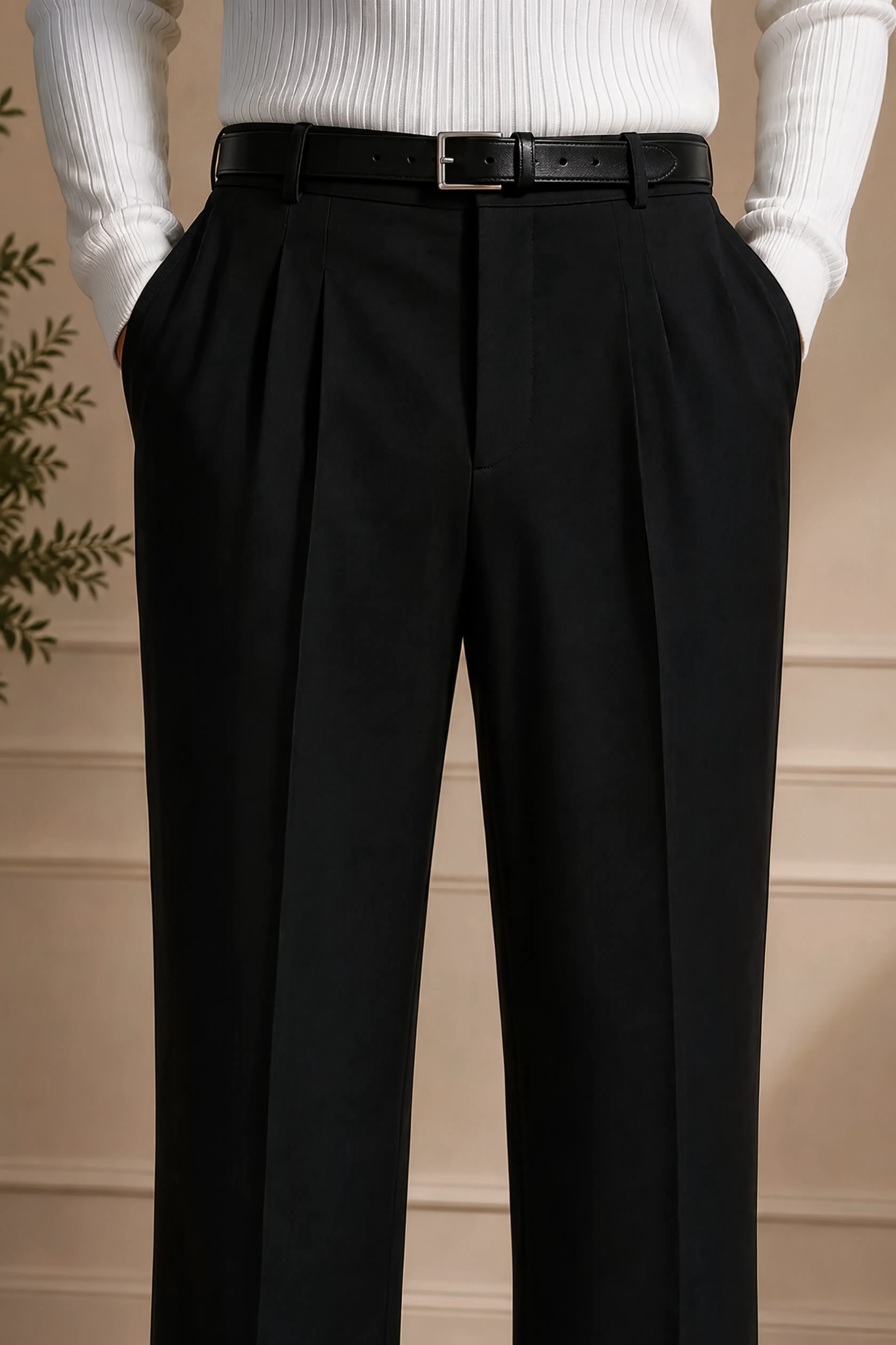 Men's black dress pants close-up of waistband with belt and pleats