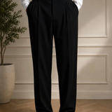 Men's black dress pants front view with pleats and straight leg