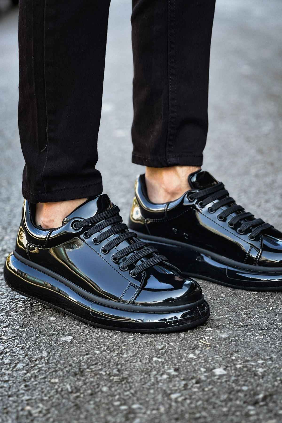 Men's black patent leather sneakers, side profile with lace-up eyelets