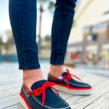 Men's navy espadrille shoes with red laces, red trim, and woven jute soles
