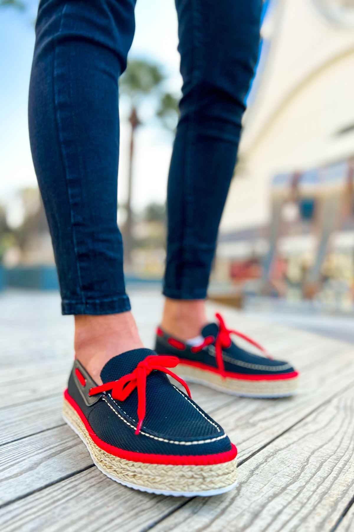 Men's navy espadrille shoes with red laces, red trim, and woven jute soles