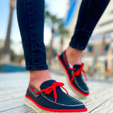 Men's espadrille loafers with red lace-up ties, dark upper, and jute-wrapped sole
