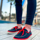 Pair of men's espadrille shoes, dark canvas with red laces and jute platform soles