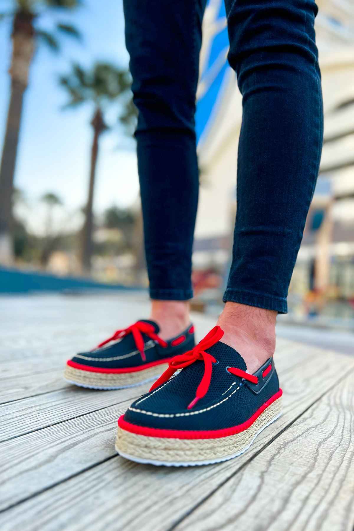 Pair of men's espadrille shoes, dark canvas with red laces and jute platform soles