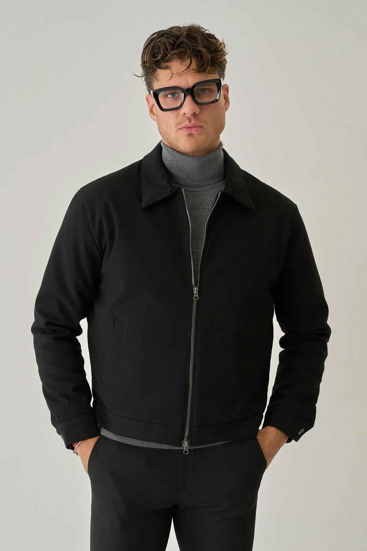 Men's black zip-up jacket with stand collar and straight hem