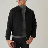 Men's black jacket with zip front and stand collar, side view