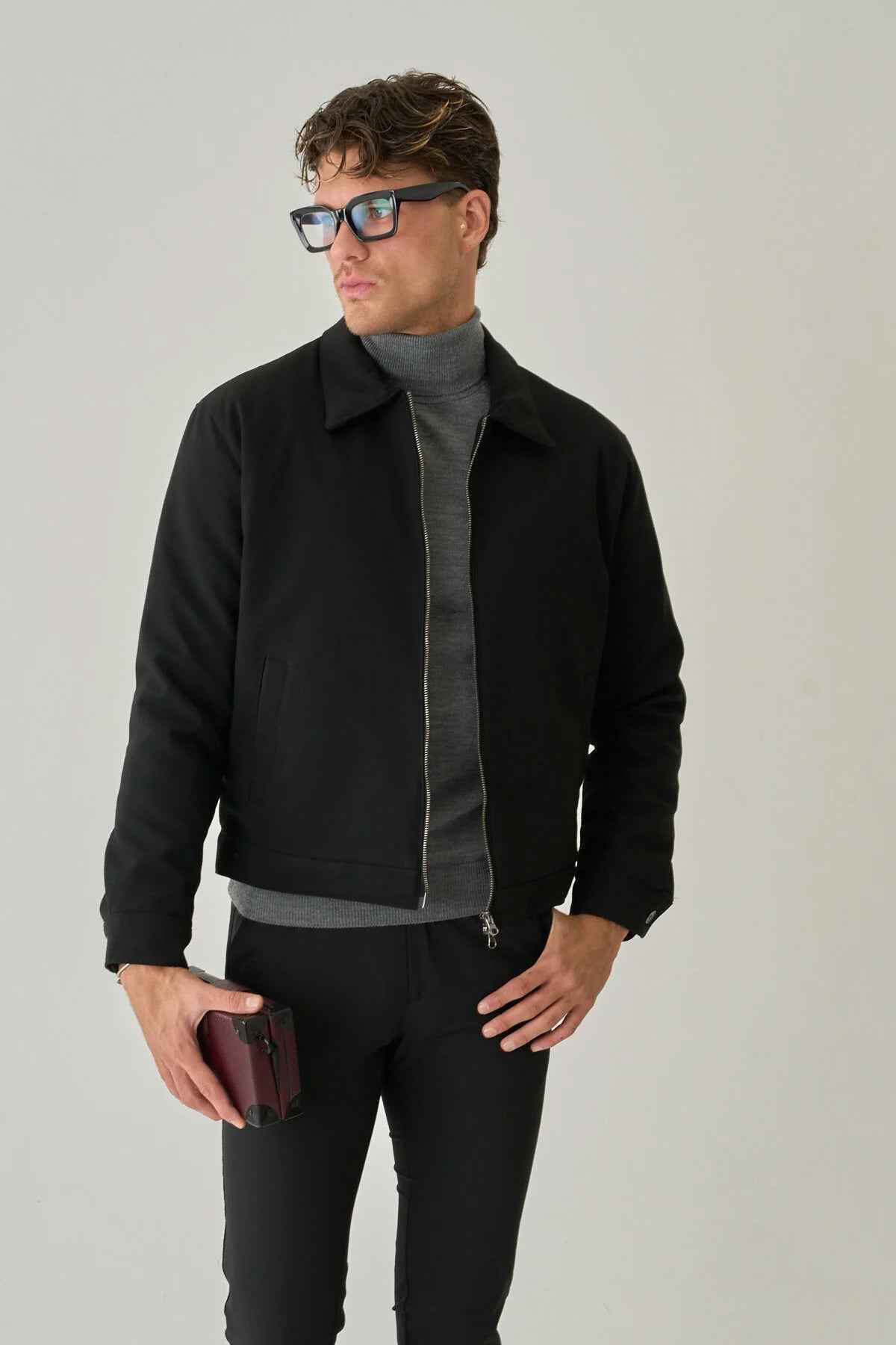 Men's black jacket with zip front and stand collar, side view