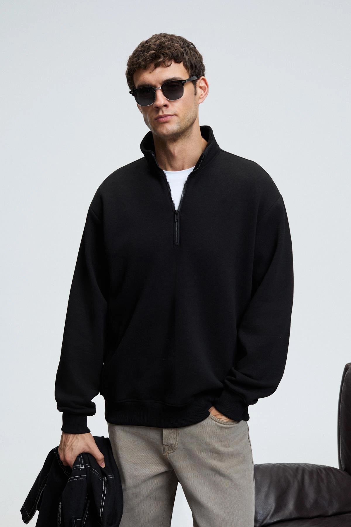 Men's black zip stand-collar sweatshirt with relaxed fit and kangaroo pocket