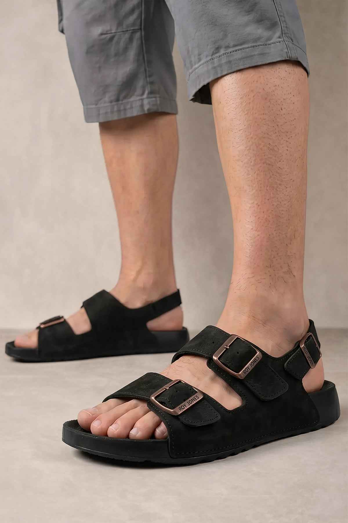 Men's black sandals with two buckle-strap bands and open toe, side view