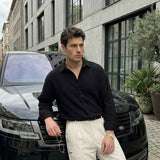 Men's black button-front shirt with long sleeves, relaxed fit