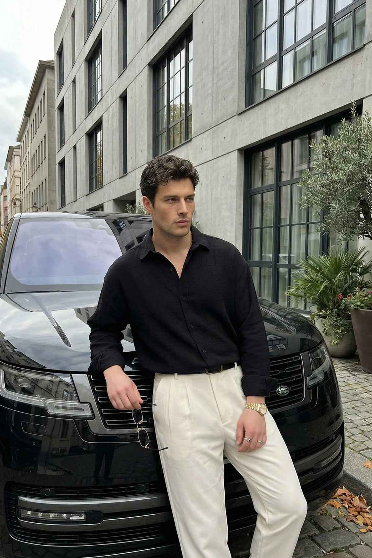 Men's black button-front shirt with long sleeves, relaxed fit