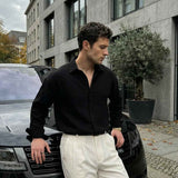 Men's black long-sleeve button-up shirt with spread collar