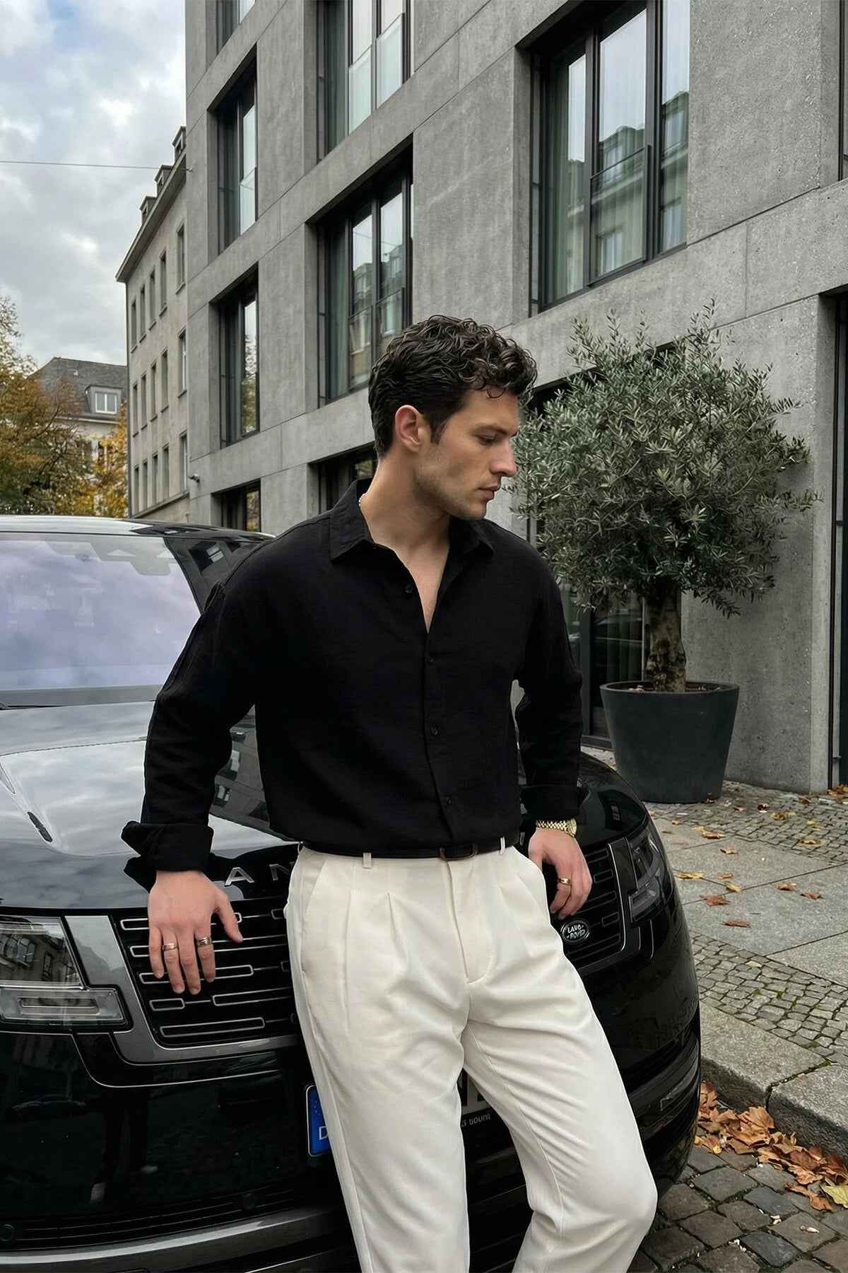 Men's black long-sleeve button-up shirt with spread collar