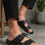 Men's black slide slippers with two wide straps and stitched trim