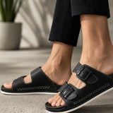 Men's black slide slippers with double straps and stitched side detailing