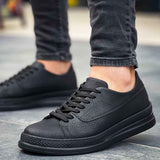 Men's black lace-up sneakers, smooth leather upper with stitched toe cap