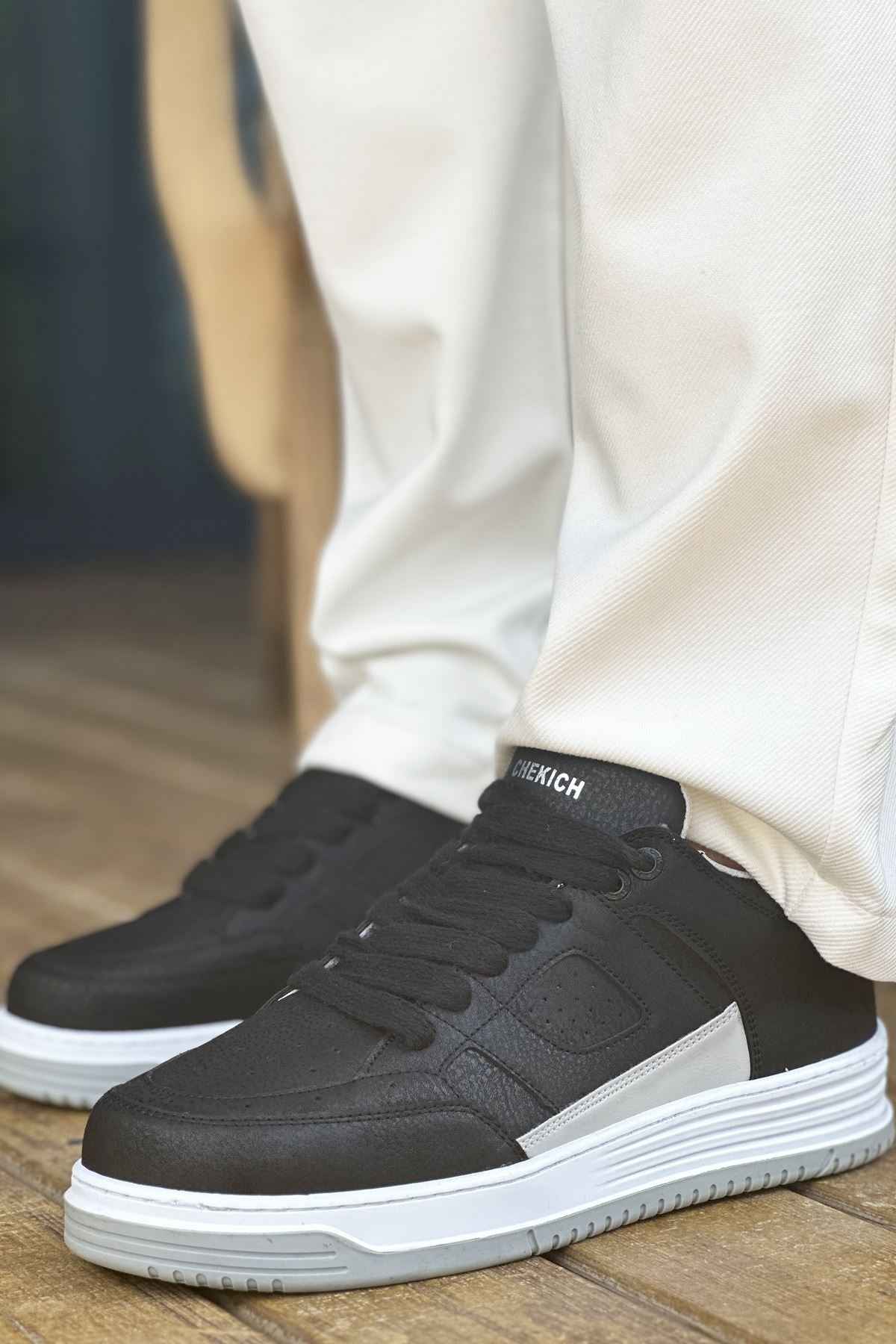 Men's black sneakers with lace-up front and white midsole