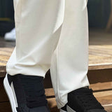 Men's black low-top sneakers with white side stripe and thick white sole