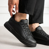 Men's black leather sneakers with lace-up front and padded ankle collar