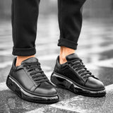 Black lace-up sneakers with chunky sole and padded heel collar