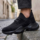 Black knit lace-up sneakers with ribbed sock collar and thick sole